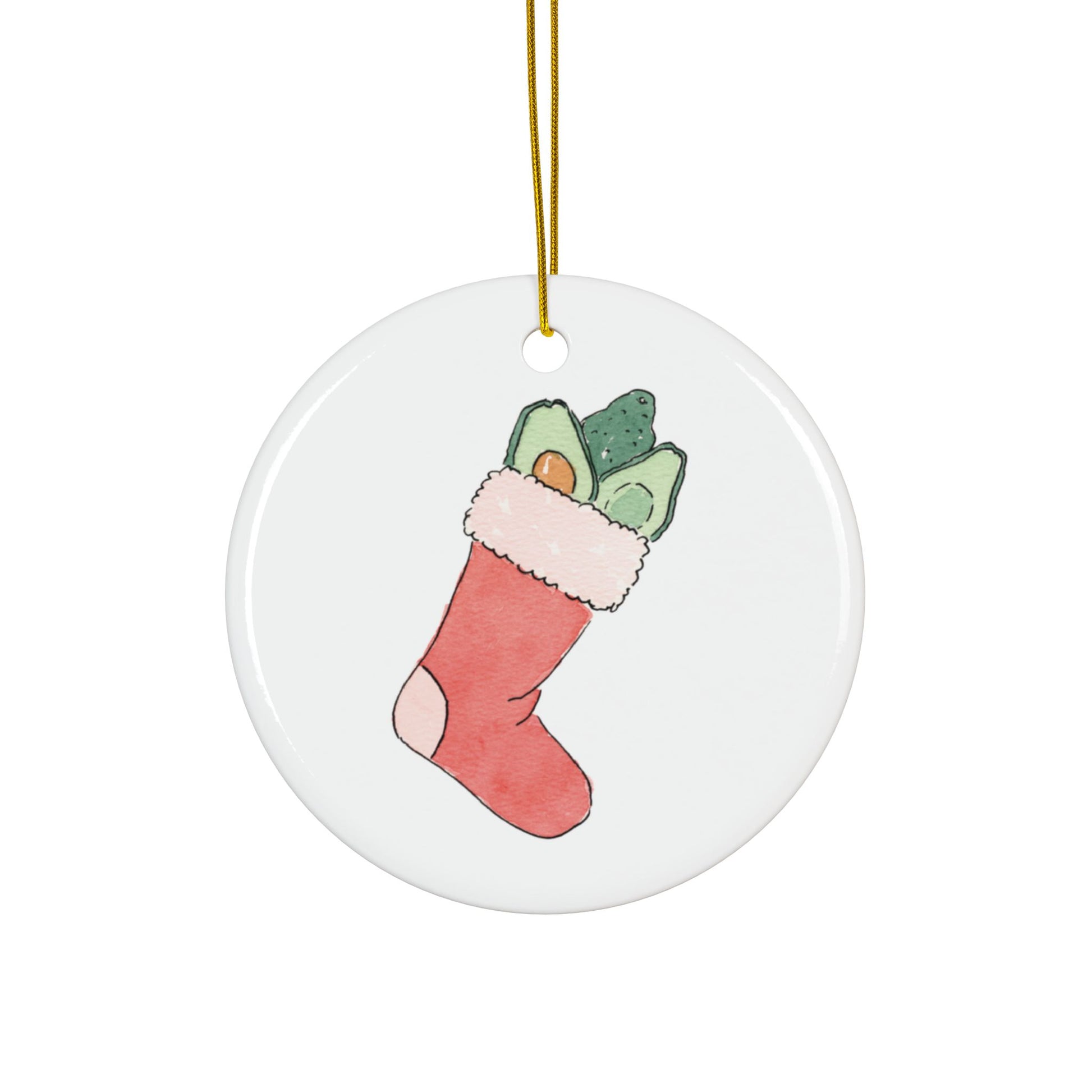 Round ceramic ornament with a Christmas stocking filled with avocados design on a white background