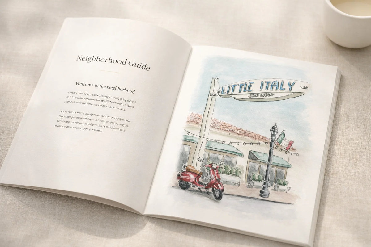 Open book with a neighborhood guide illustration of Little Italy on a table. Watercolor illustration by Swil Arts
