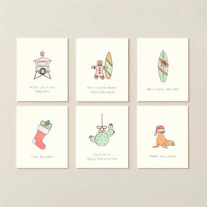 Set of six Christmas-themed cards on a beige background