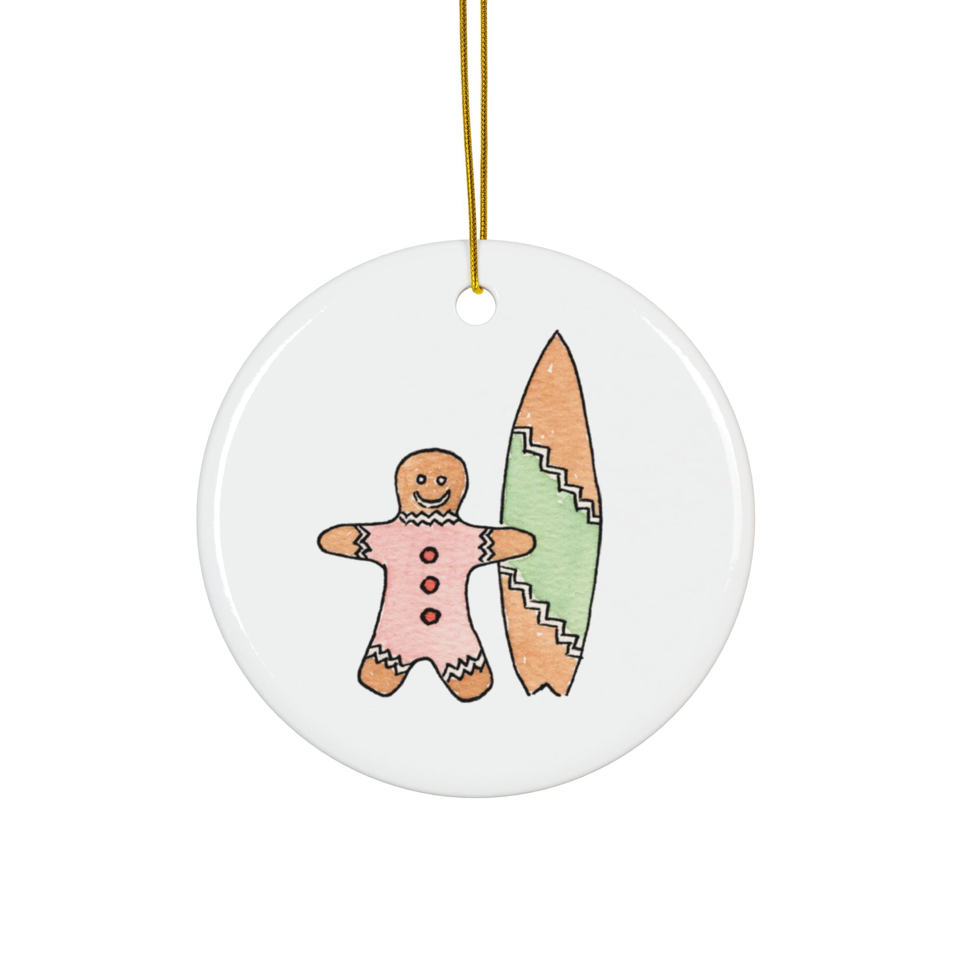 Round Christmas ceramic ornament with a surfer gingerbread man and a surfboard design on a white background.