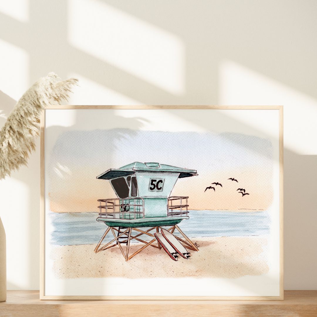 Guardian of the Shores by Swil Arts is a framed coastal wall art featuring a lifeguard tower 5C, ocean waves, sandy shore, and birds—perfect for Southern California watercolor art enthusiasts.
