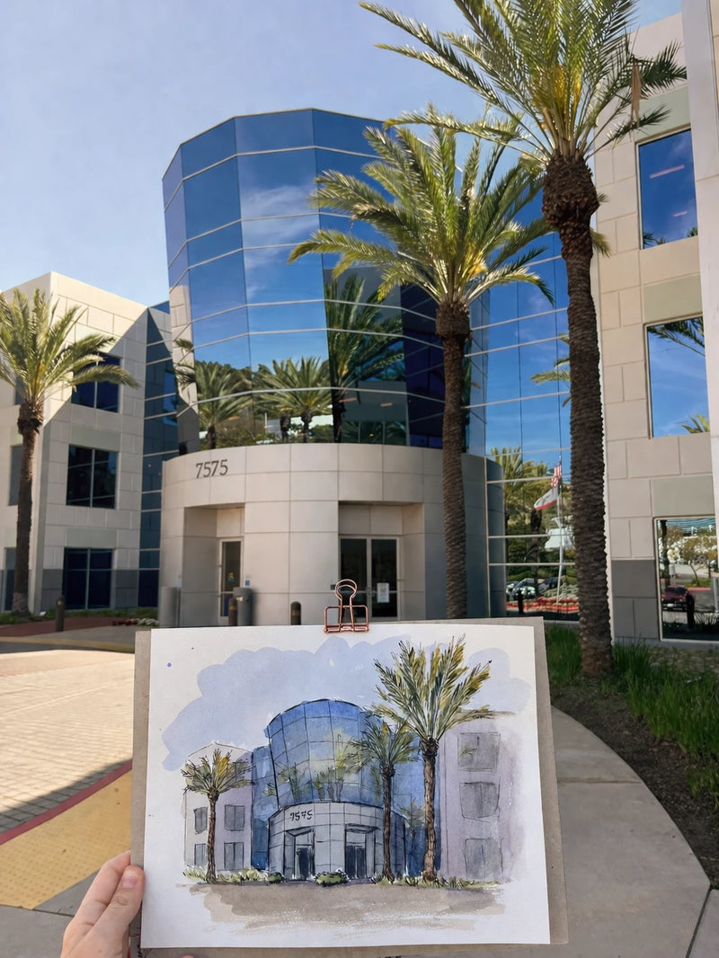 Handheld watercolor and ink painting of a modern building with palm trees in front
