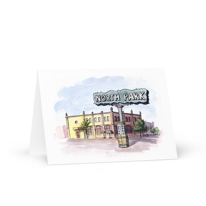 Something Brewing on 30th greeting card featuring a watercolor illustration of North Park, San Diego, with buildings and a sign.