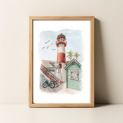 Framed watercolor painting of a red and white lighthouse, a beach shack, a bicycle, and flying birds.