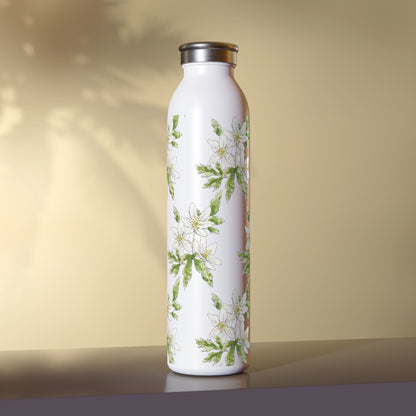 White stainless steel water bottle featuring a wood anemone flower watercolor pattern, set against a warm beige background with soft leaf shadows.