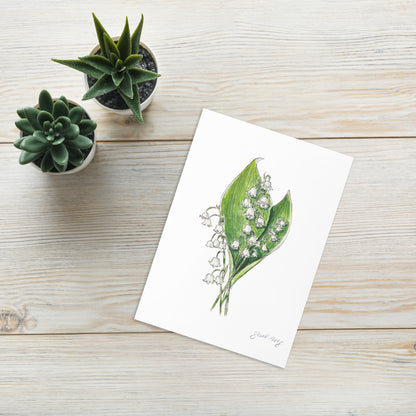 Lily of the Valley flower greeting card with a delicate watercolor and ink illustration. Botanical note card featuring a woodland-inspired floral design, perfect for nature lovers. The greeting card is nicely set with 2 small plants adding charm to the location.