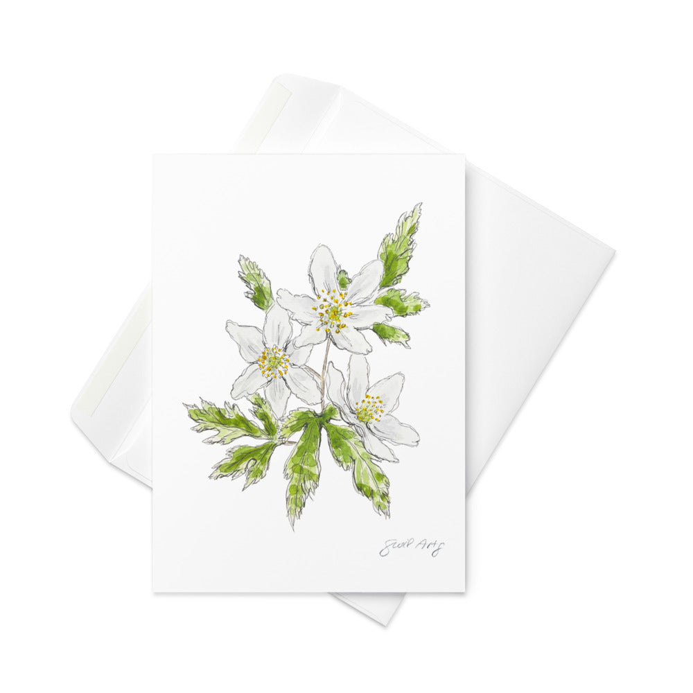 Wood anemone flower greeting card with watercolor and ink botanical illustration. Elegant woodland-inspired note card with blank interior, perfect for nature lovers and special occasions. Sophisticated with white envelope below it.