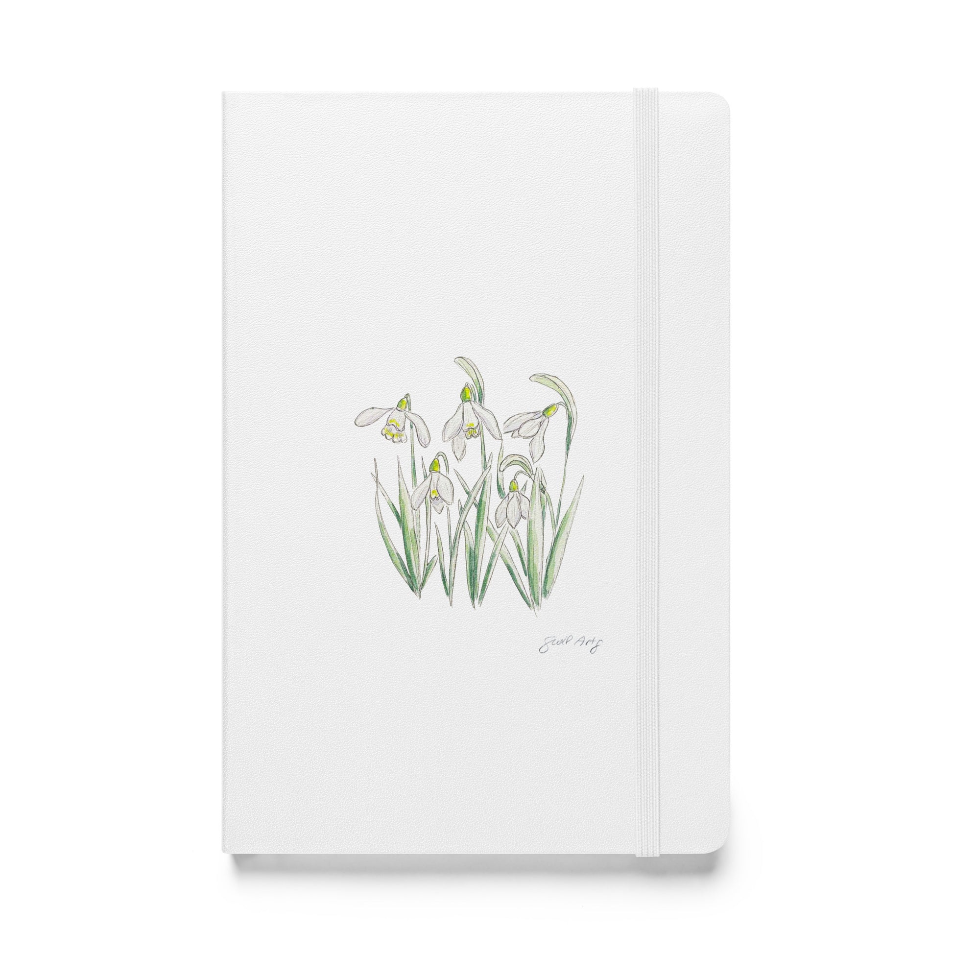 White hardcover notebook featuring a delicate snowdrop flower illustration by Swil Arts. This botanical watercolor and ink design showcases the beauty of nature, making it perfect for journaling, sketching, or note-taking. The notebook includes an elastic closure for convenience, ideal for artists, writers, and nature lovers seeking elegant stationery with a floral touch