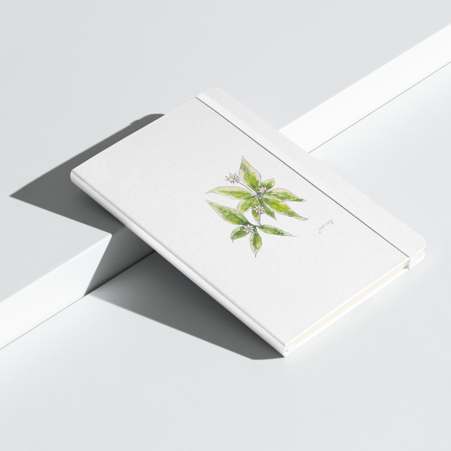 White hardcover notebook featuring a delicate starflower illustration by Swil Arts. This botanical watercolor and ink design showcases the beauty of nature, making it perfect for journaling, sketching, or note-taking. The notebook includes an elastic closure for convenience, ideal for artists, writers, and nature lovers seeking elegant stationery with a floral touch.
