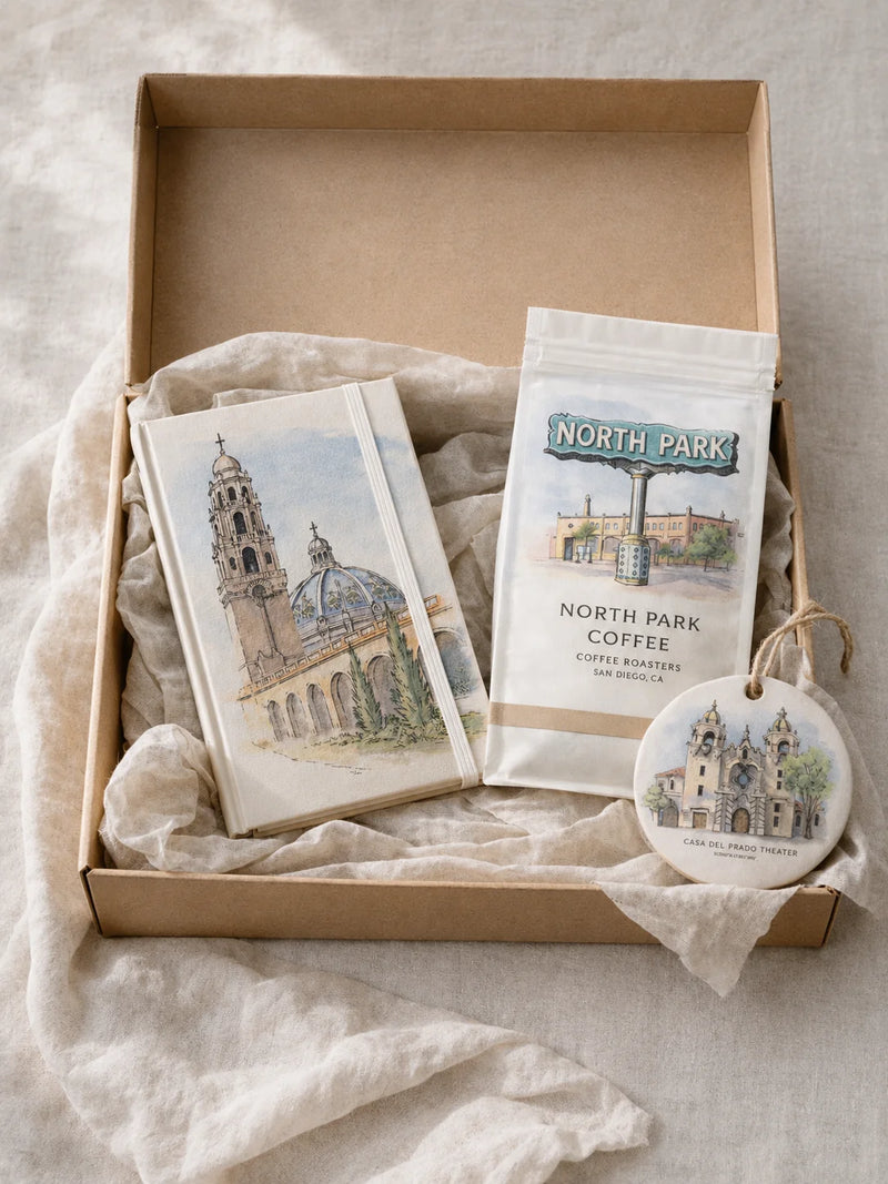 Gift set with coffee package, cards, and ornament on a textured surface