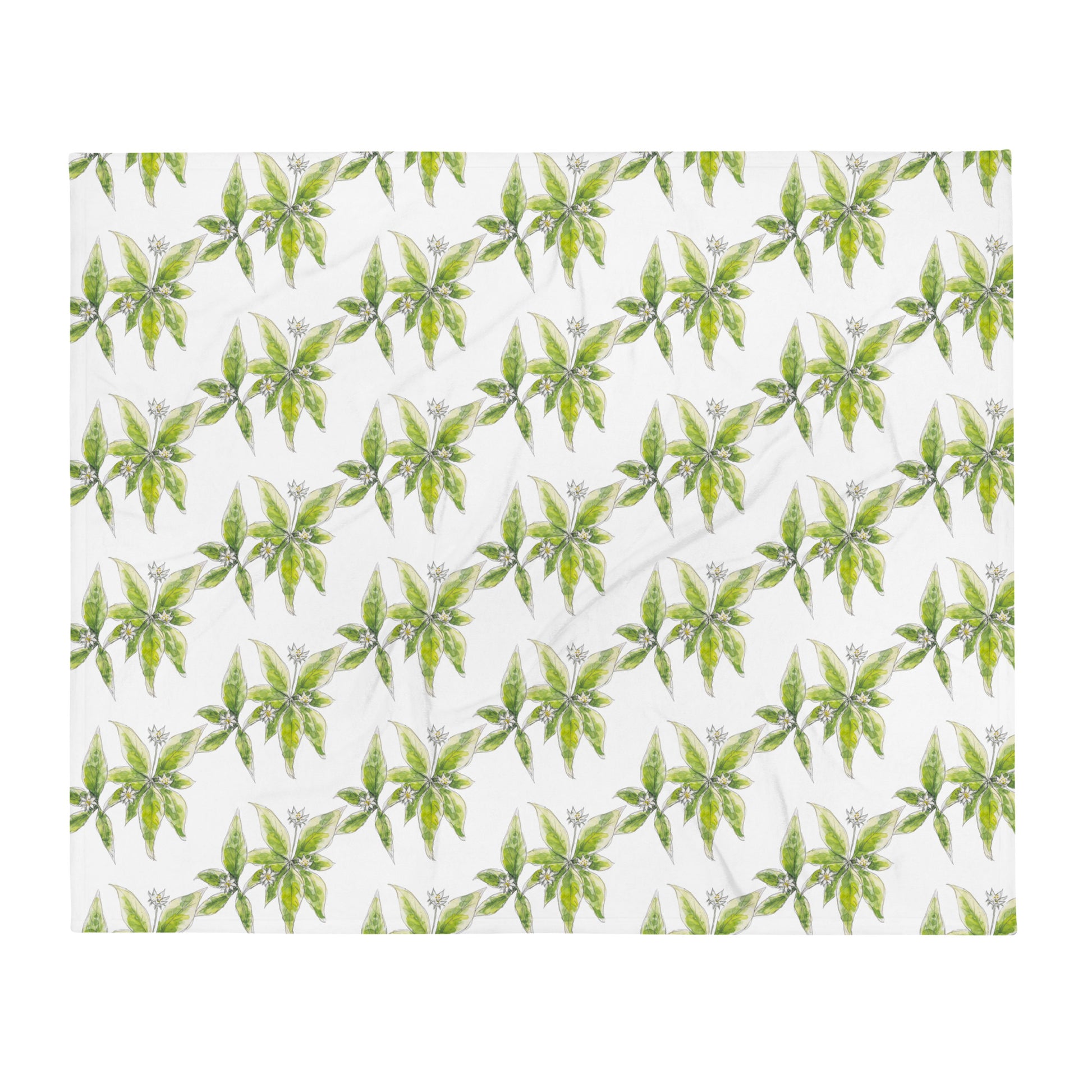 Soft fleece throw blanket featuring a white starflower pattern with green leaves. Cozy botanical home décor with nature-inspired watercolor design.