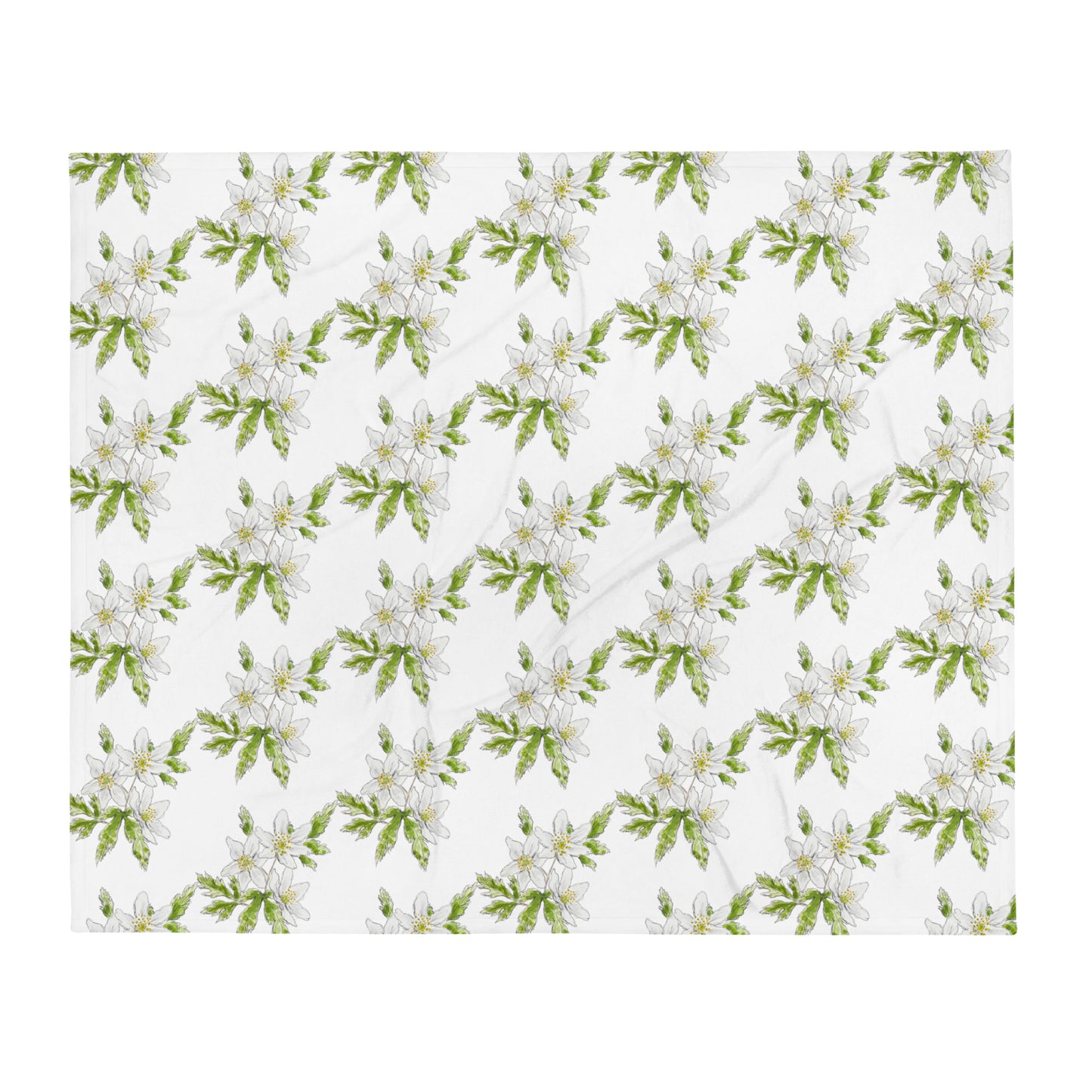 Soft fleece throw blanket featuring a white wood anemone flower pattern with green leaves. Cozy botanical home décor with nature-inspired watercolor design.